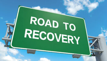 road sign saying 'road to recovery'