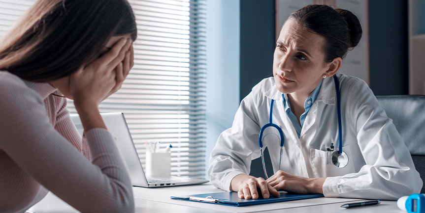 Physician discussing an emotion topic with a patient.