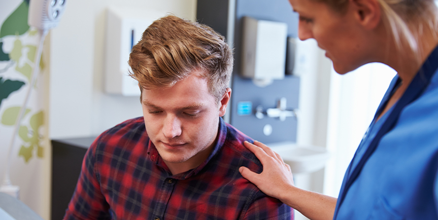 Medical professional comforting a patient