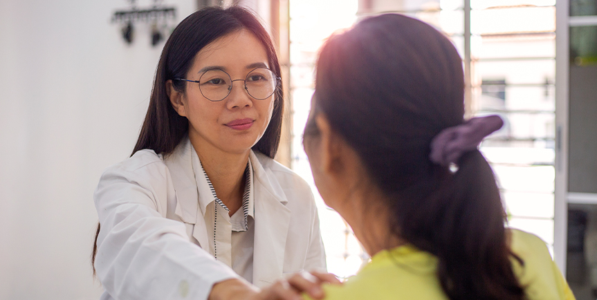 Doctor comforting a patient