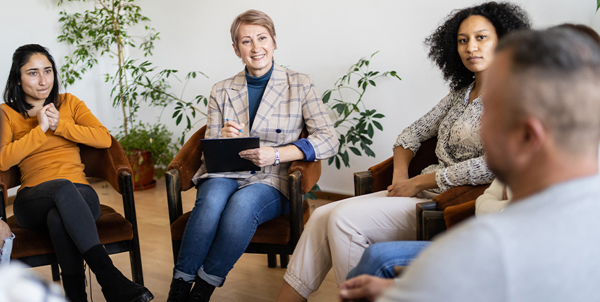 Support group gathered together in a circle