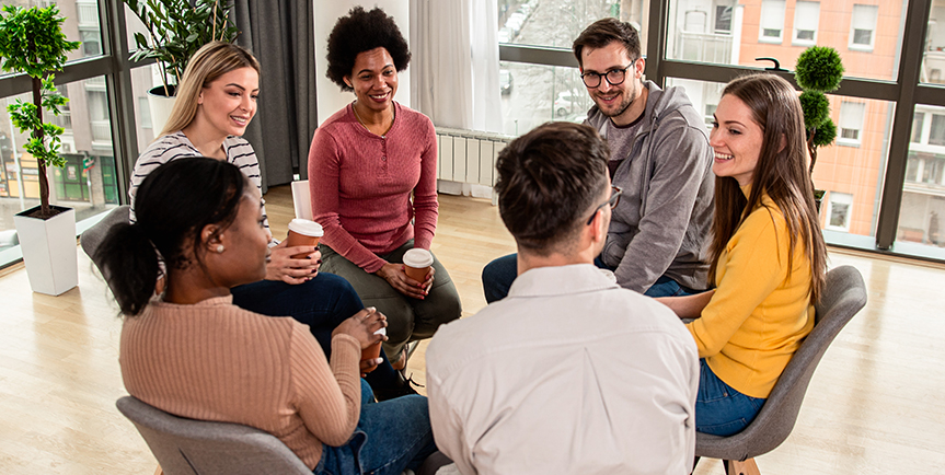 Group of adults meeting for a support group.