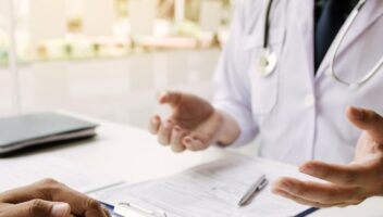 Doctor talking with patient