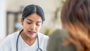 female doctor writing prescription